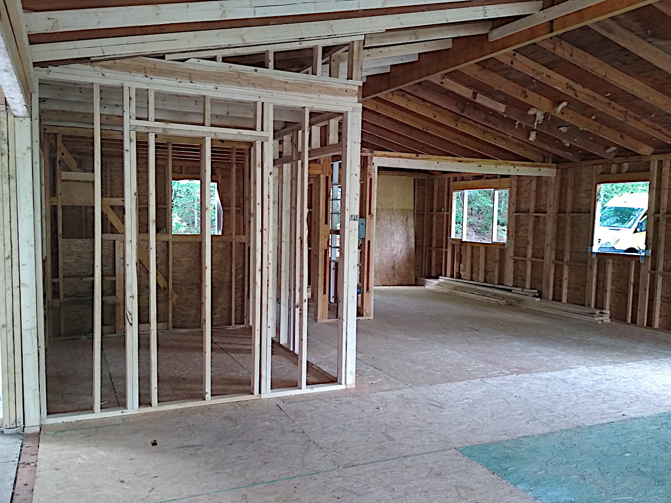 View through living room, kitchen, and pantry toward southwest corner