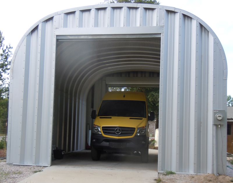 Rear of garage with van parked inside