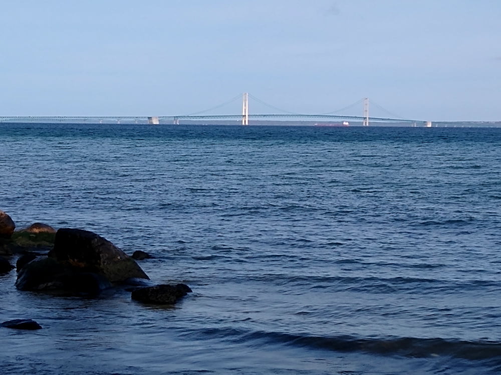 Straits of Mackinac - Great Lakes Freighter Passing Under Mackinac Bridge