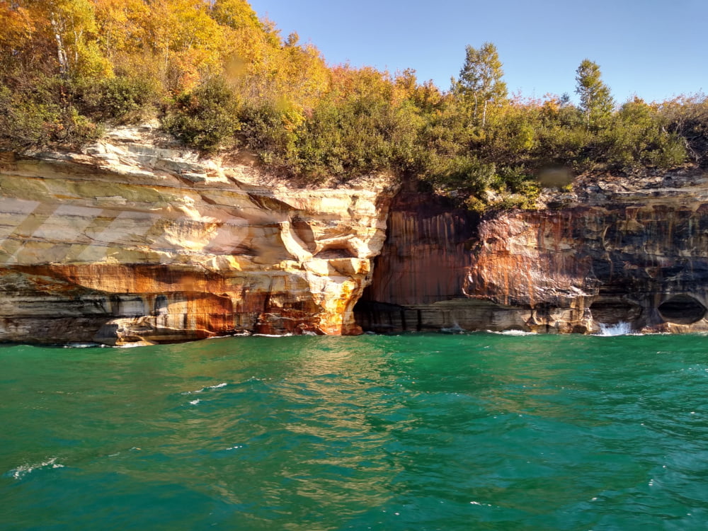 Shallow Caves at the Cliff Face with Turquoise Water