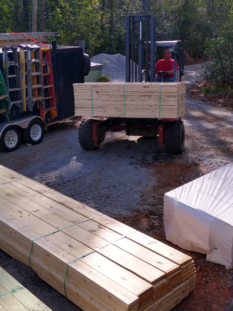 Forklift delivering lumber