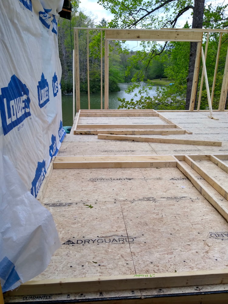 Addition floor - back wall with entry door frame awaiting errection