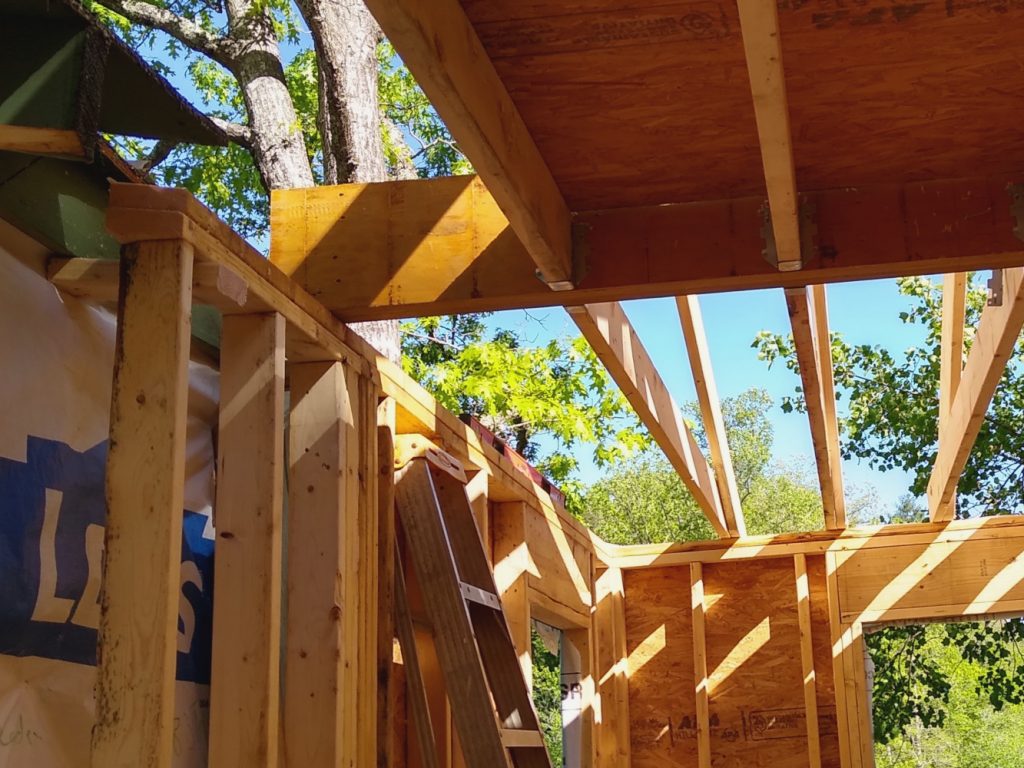 Inboard end of ceiling joist hanger beam