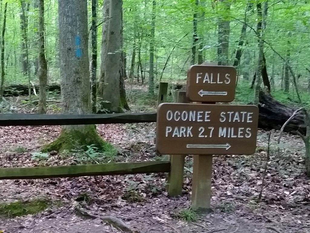 Sign pointing to falls and Oconee State Park in opposite directions